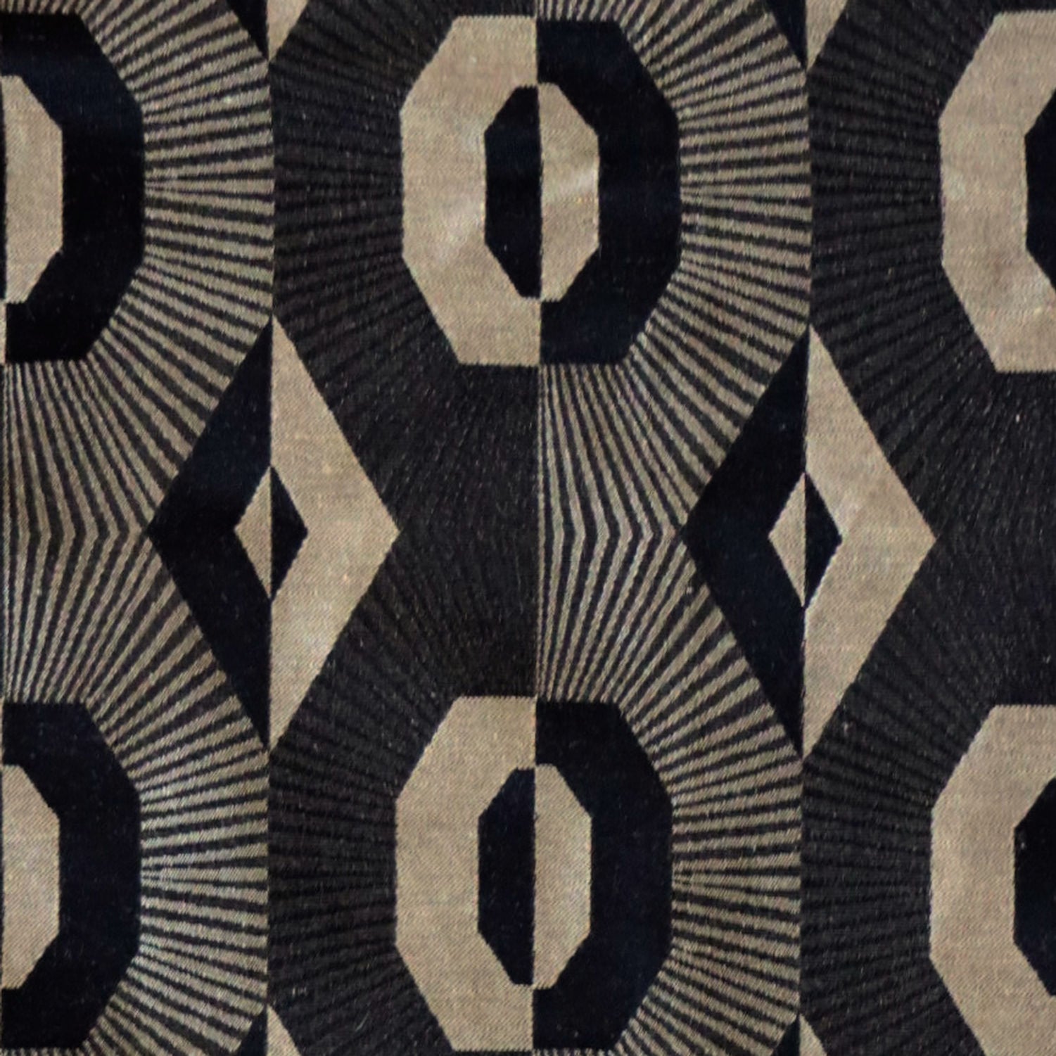 Close-up detail of Voisin Black fabric from Arte Fresca Outlet, highlighting the intricate reversible weave and luxurious texture of this English curtain and upholstery material.