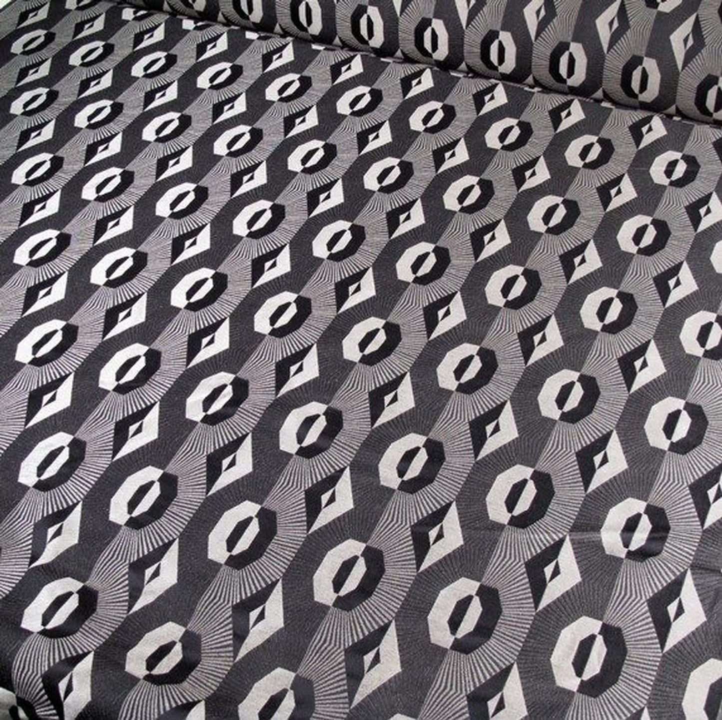 Voisin Black fabric by Arte Fresca Outlet, showcasing its striking geometric pattern in deep black and refined beige, ideal for elegant interiors.