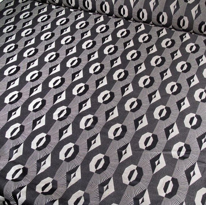 Voisin Black fabric by Arte Fresca Outlet, showcasing its striking geometric pattern in deep black and refined beige, ideal for elegant interiors.