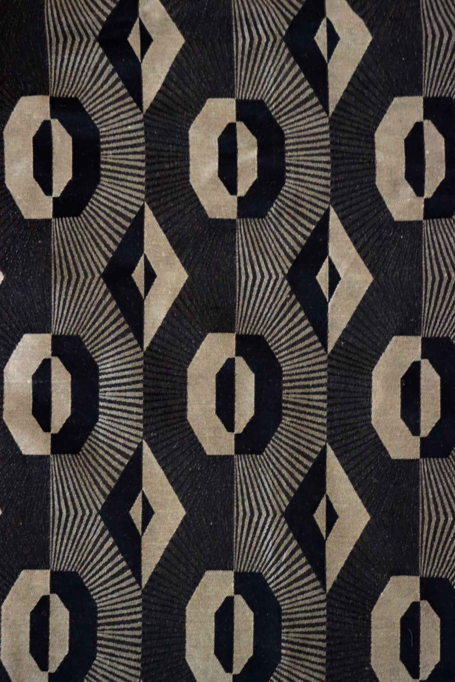 Voisin Black fabric by Arte Fresca Outlet, showcasing its striking geometric pattern in deep black and refined beige, ideal for elegant interiors.
