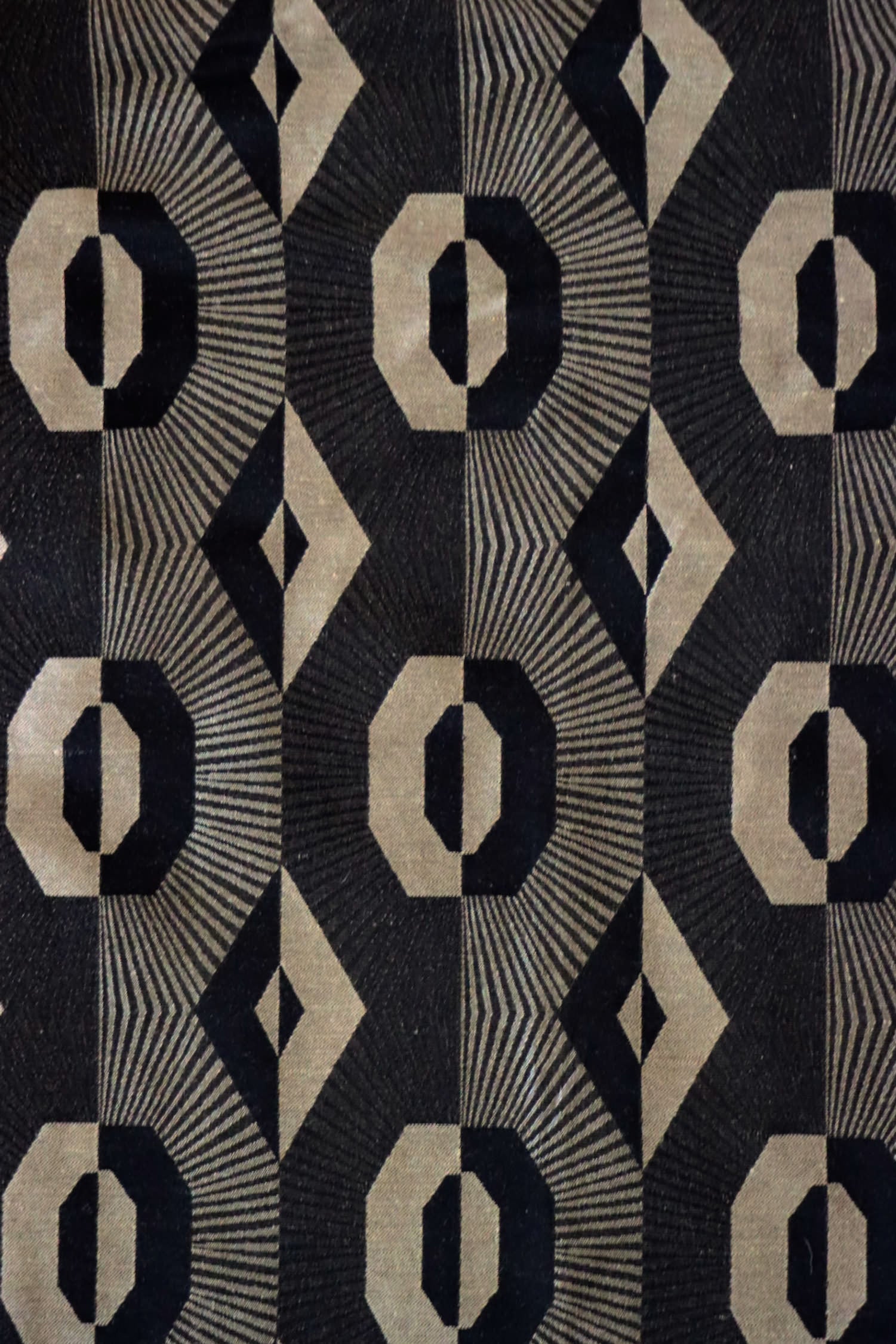 Voisin Black fabric by Arte Fresca Outlet, showcasing its striking geometric pattern in deep black and refined beige, ideal for elegant interiors.